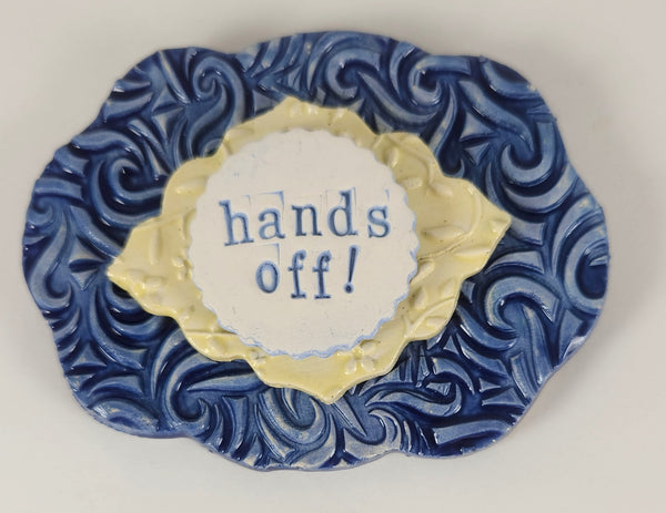 "Hands Off" word plaque