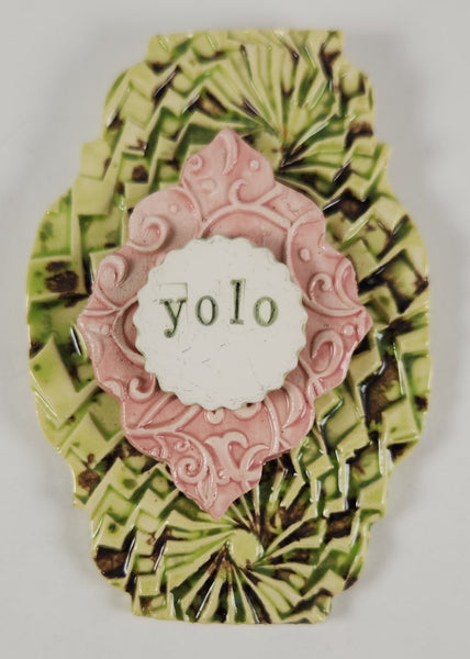 "YOLO" word plaque