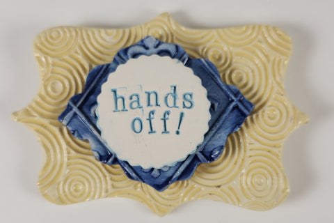 "Hands Off" word plaque