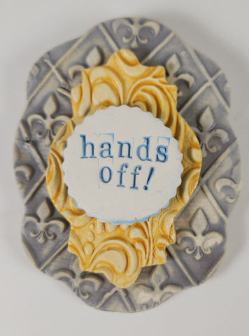 "Hands Off" word plaque