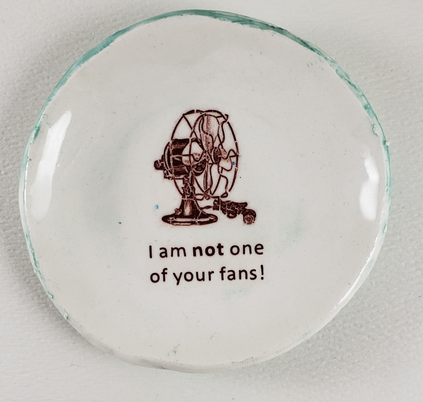 Tiny Plate with "I am not one of your fans!"